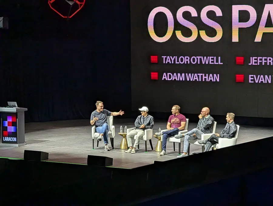 A live open-source conference panel on stage