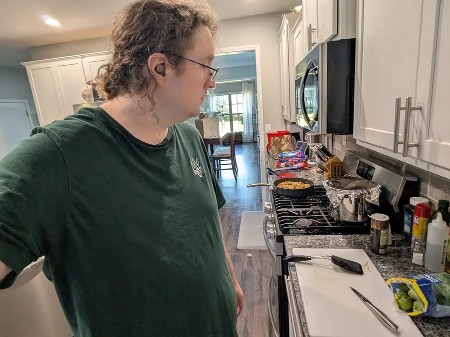 Sean Talbot cooking at the stove in his kitchen